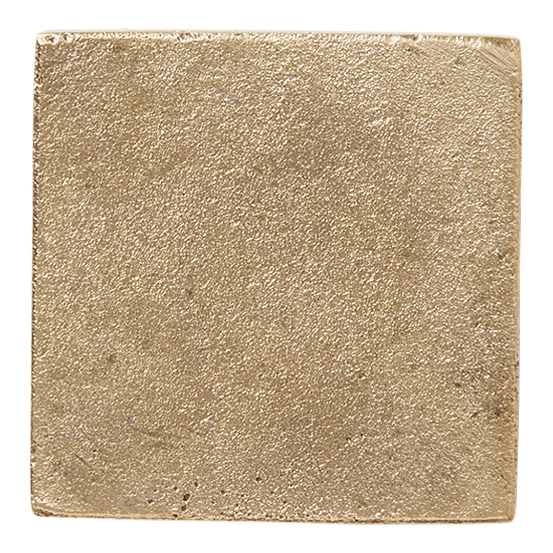 Textured gold square tile with a shiny, metallic finish and subtle surface variations. Ideal for modern decor.