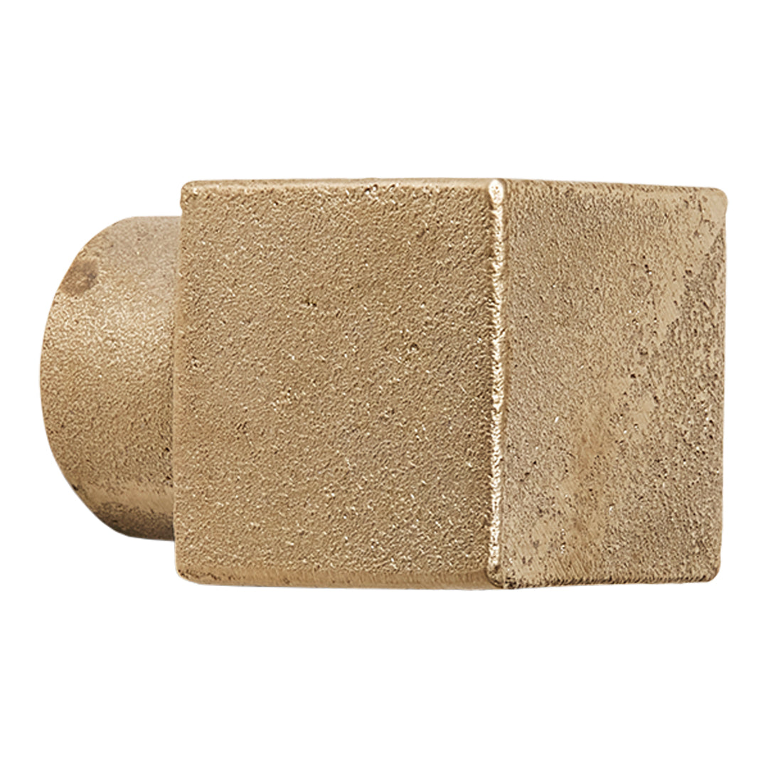Textured beige cube with a smooth circular base, showcasing a minimalist design and earthy color palette.