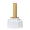 White textured candle holder with a smooth yellow candles, perfect for a cozy, modern decor.