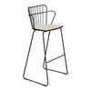 Black wire bar stool with a natural wood seat and minimalist design, showcasing modern industrial patterns.