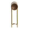 Modern brass stand with a wooden circular top, featuring a sleek, minimalist design in warm tones.