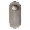 Brushed nickel door knob with an oval backplate and smooth, minimalist design. Elegant metallic finish.
