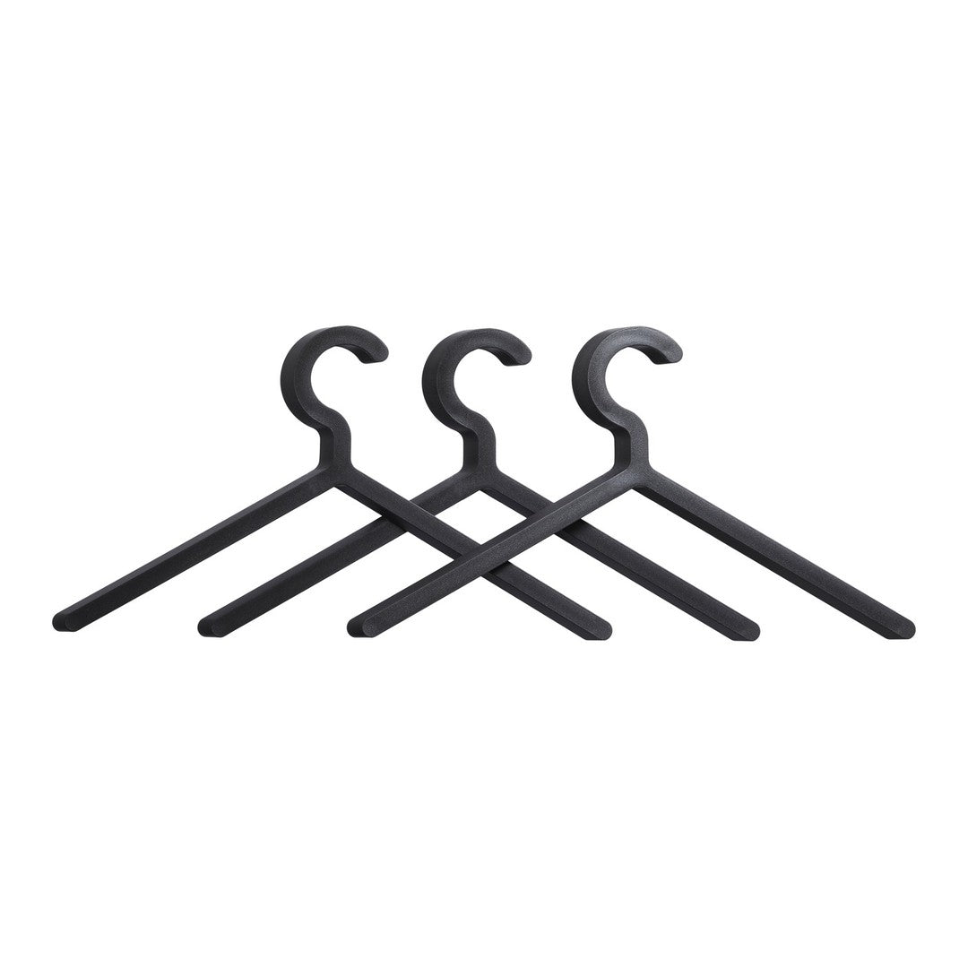 Set of three matte black hangers with a sleek, minimalist design, perfect for modern storage solutions.