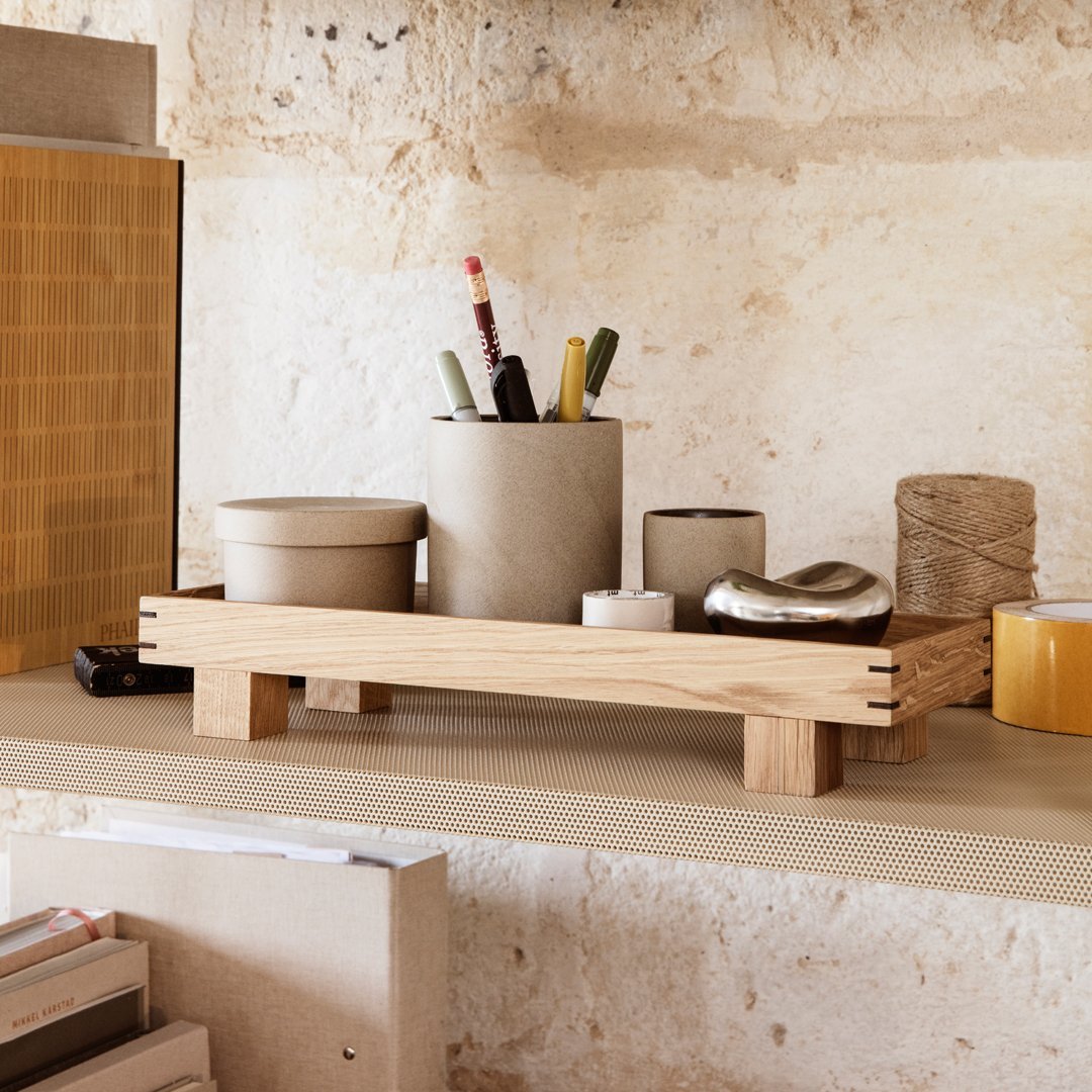 Natural wood organizer with neutral ceramic and metallic accents, showcasing earthy tones and minimalist design.
