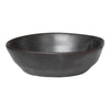 Handcrafted black ceramic bowl with a smooth, matte finish and a minimalist design. Perfect for modern dining.