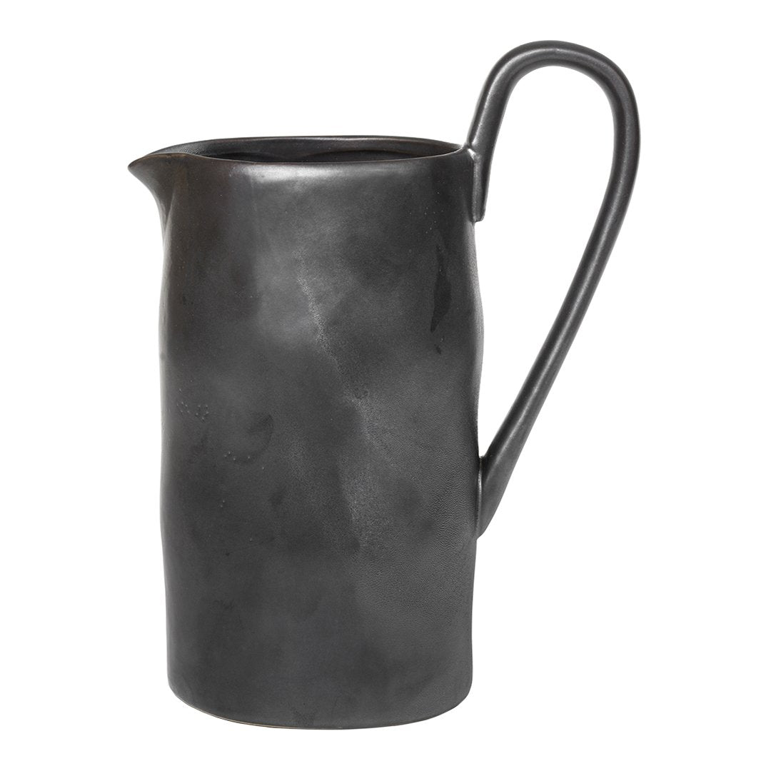 Black ceramic pitcher with a sleek, matte finish and subtle curved texture. Perfect for modern table settings.