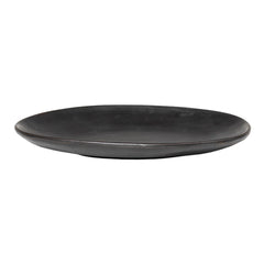Black ceramic plate with a smooth, matte finish and a minimalist design, perfect for stylish table settings.