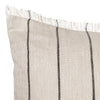 Beige pillow with contrasting black vertical stripes and fringed edges. Perfect for a modern, cozy decor.