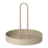 Beige round tray with a simple handle, featuring a smooth, matte finish and minimalistic design.
