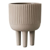 Beige ribbed planter with three legs, showcasing a modern, minimalist design. Perfect for any decor.