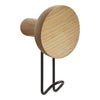 Natural wood knob with a round oak finish, paired with a sleek black metal hook. Minimalist and modern design.