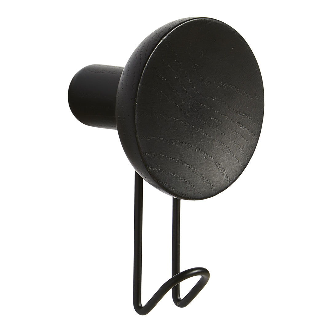 Sleek black wall hook with a round top and minimalist design, perfect for modern decor.