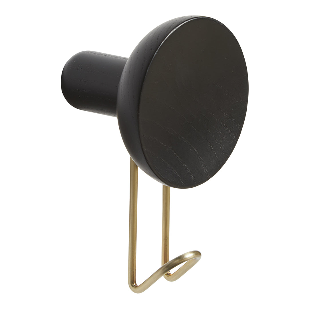 Black round wall hook with a sleek gold metal hook for a modern touch. Perfect for minimalistic decor.