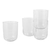 Set of four clear glass tumblers with a smooth, minimalist design, showcasing transparent elegance and modern flair.