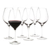 Set of six elegant wine glasses, showcasing clear glass with a sleek design, featuring a rich red wine in one glass.