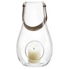 Clear glass lantern with sleek design, featuring a minimalist pattern and a soft white candle inside.