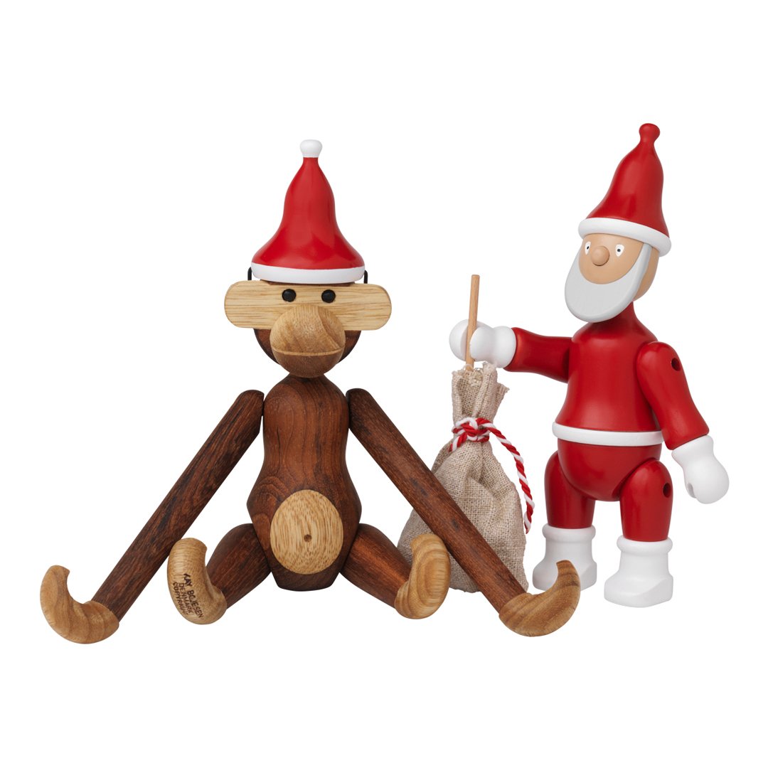 Festive wooden monkey and Santa figures in red hats, featuring a rich brown and cream color scheme. Perfect for holiday decor.