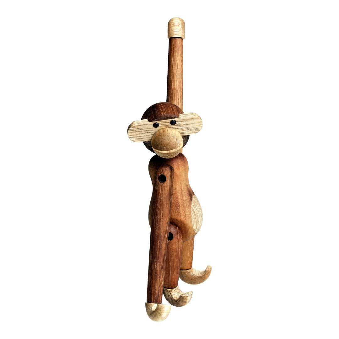 Wooden monkey wall hook with a natural finish, featuring shades of brown and light tan, showcasing playful design elements.
