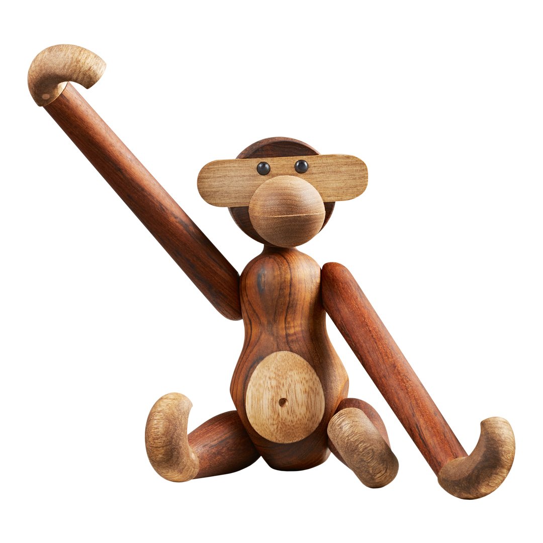 Wooden monkey figurine in brown and beige tones with a playful pose and smooth, natural finish.