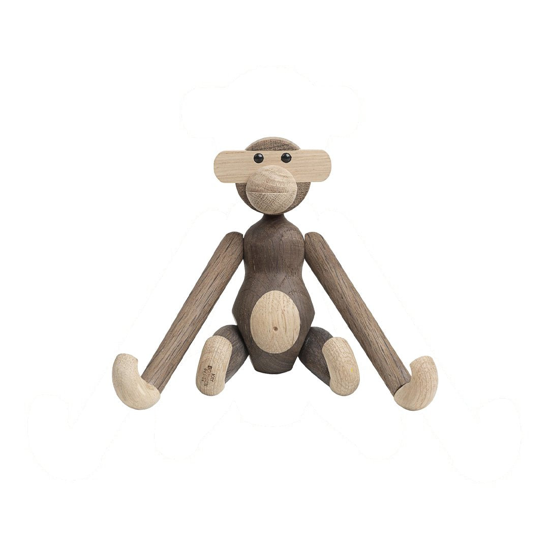 Wooden monkey figurine in natural tones of light and dark brown, featuring smooth, minimalist design.