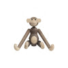 Wooden monkey figurine in natural tones of light and dark brown, featuring smooth, minimalist design.