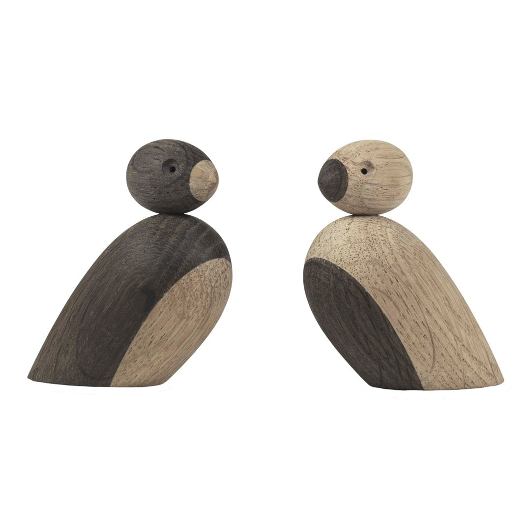 Set of two wooden bird figures in natural tones, featuring contrasting dark and light wood patterns.