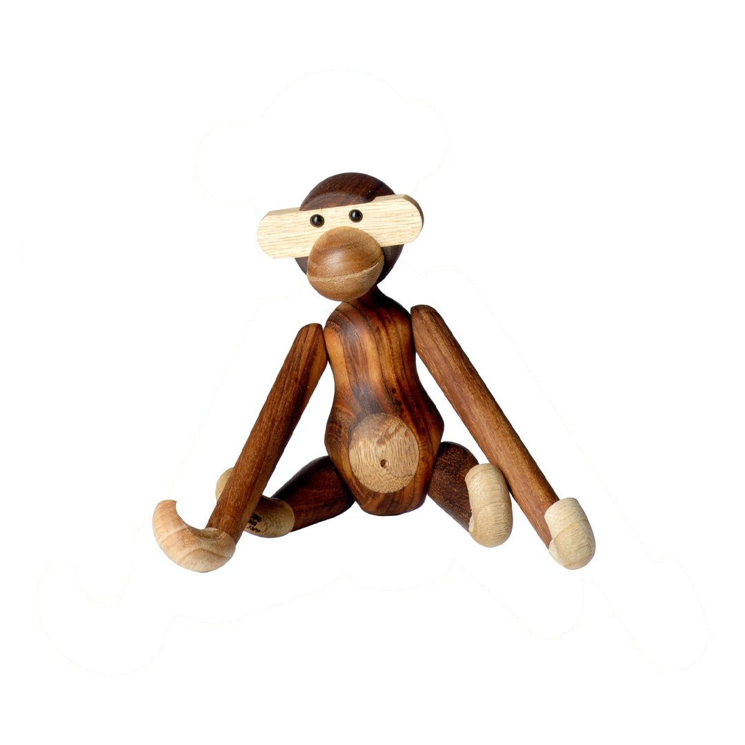 Wooden monkey figurine in rich brown and light beige tones with smooth, natural wood grain patterns.