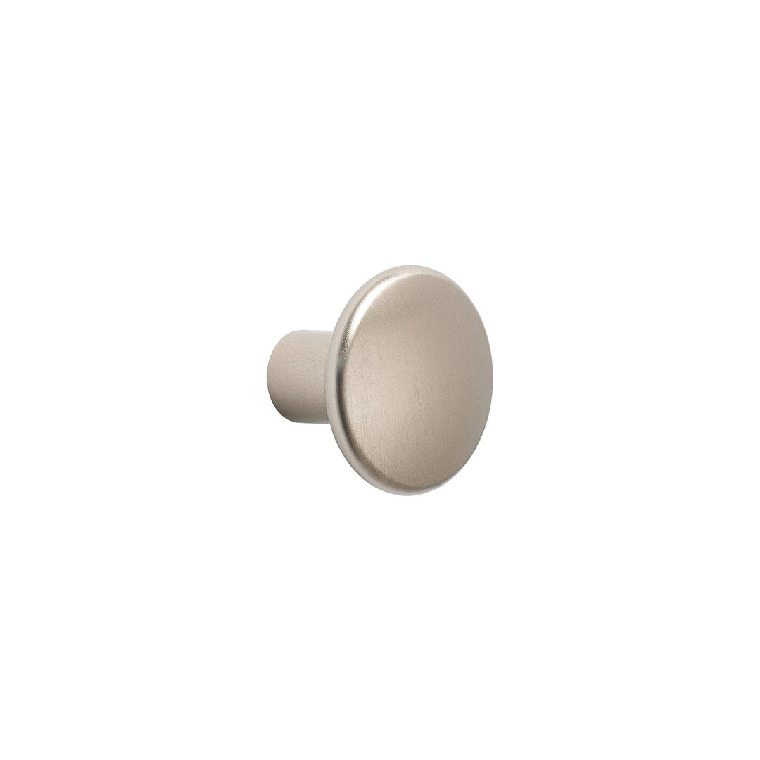 Brushed nickel round cabinet knob with a smooth, shiny finish and minimalist design. Perfect for modern interiors.