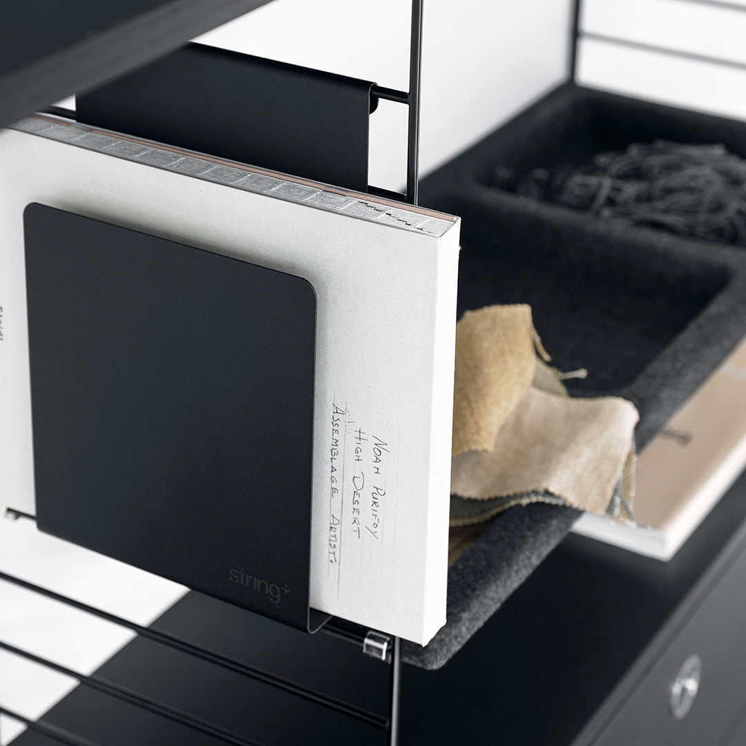 Modern black and white design with soft gray and beige accents, featuring sleek geometric patterns.