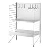 Metal storage rack with a sleek silver finish and a pegboard back, featuring multiple hooks and open shelving.