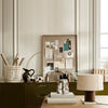 Modern desk decor featuring earth tones, muted greens, and soft neutrals with geometric patterns and textures.