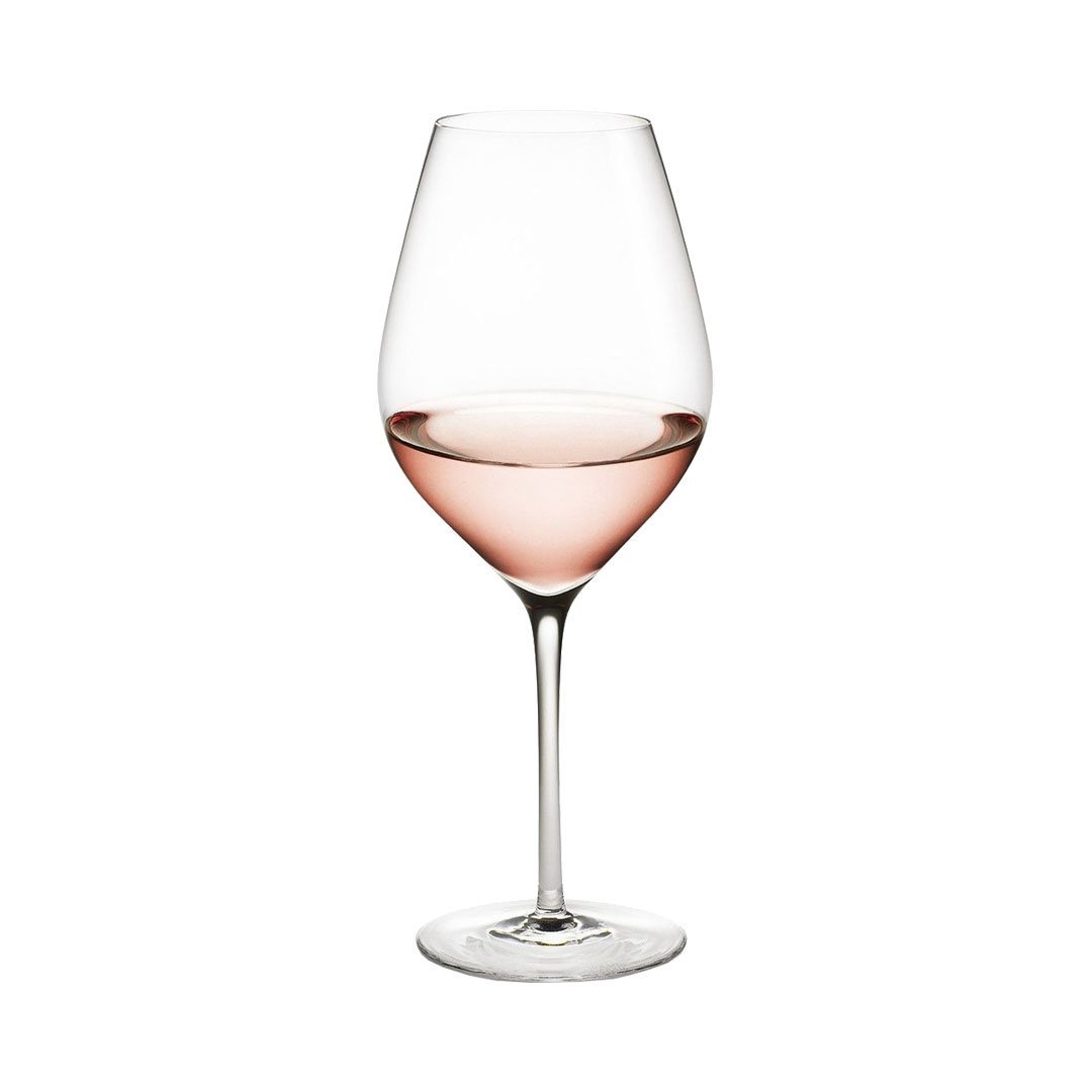 Elegant wine glass filled with light pink rosé, featuring a clear glass design for enhanced presentation.
